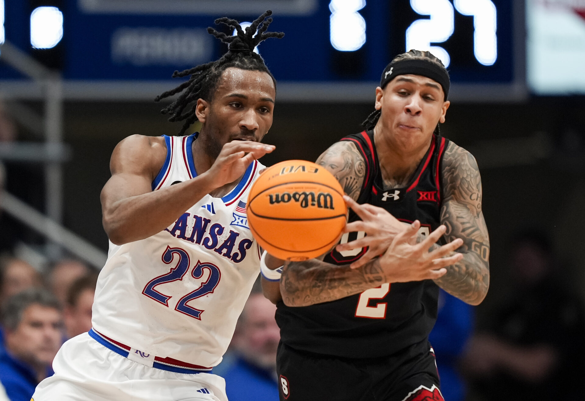Utah Utes guard Terrence Brown (2) steals the ball from Kansas Jayhawks guard Darryn Peterson (22) during the first half at Allen Fieldhouse.