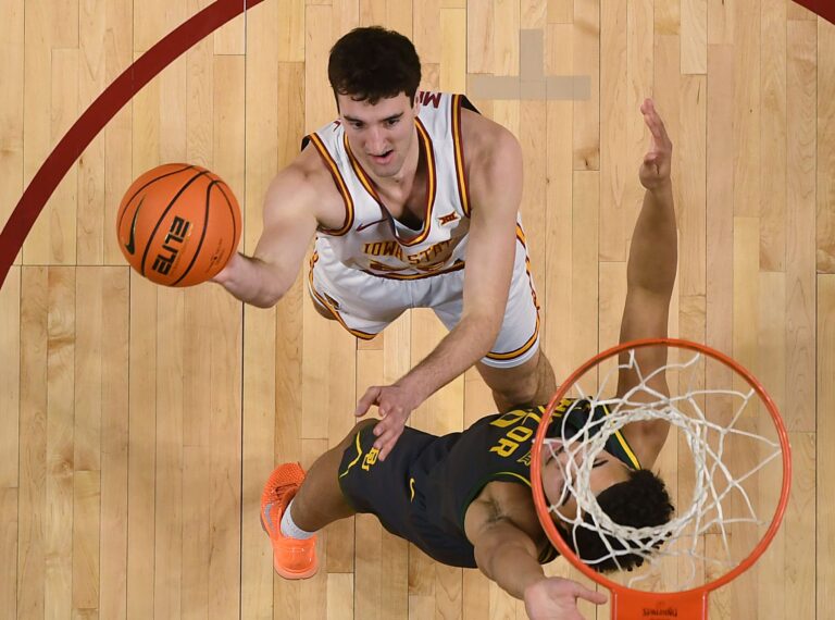 Iowa State Cyclones forward Milan Momcilovic (22) goes for a layup around Baylor Bears guard Isaac Williams IV (10) during the first half against Baylor in the Big-12 men’s basketball on Feb. 7, 2026, at Hilton Coliseum in Ames, Iowa