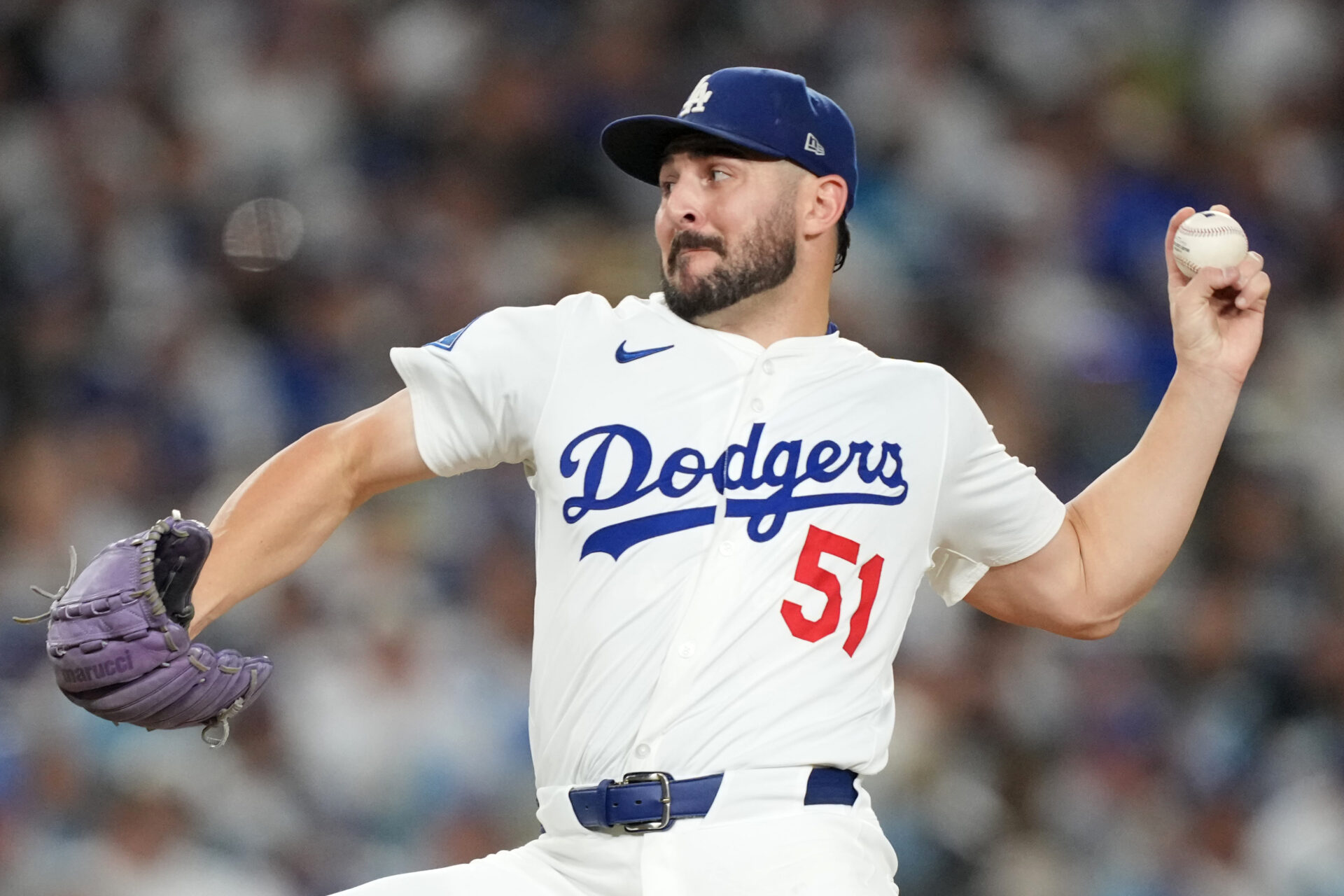 Los Angeles Dodgers pitcher Alex Vesia (51) pitches against the Milwaukee Brewers in the seventh inning during game four of the NLCS round for the 2025 MLB playoffs at Dodger Stadium.