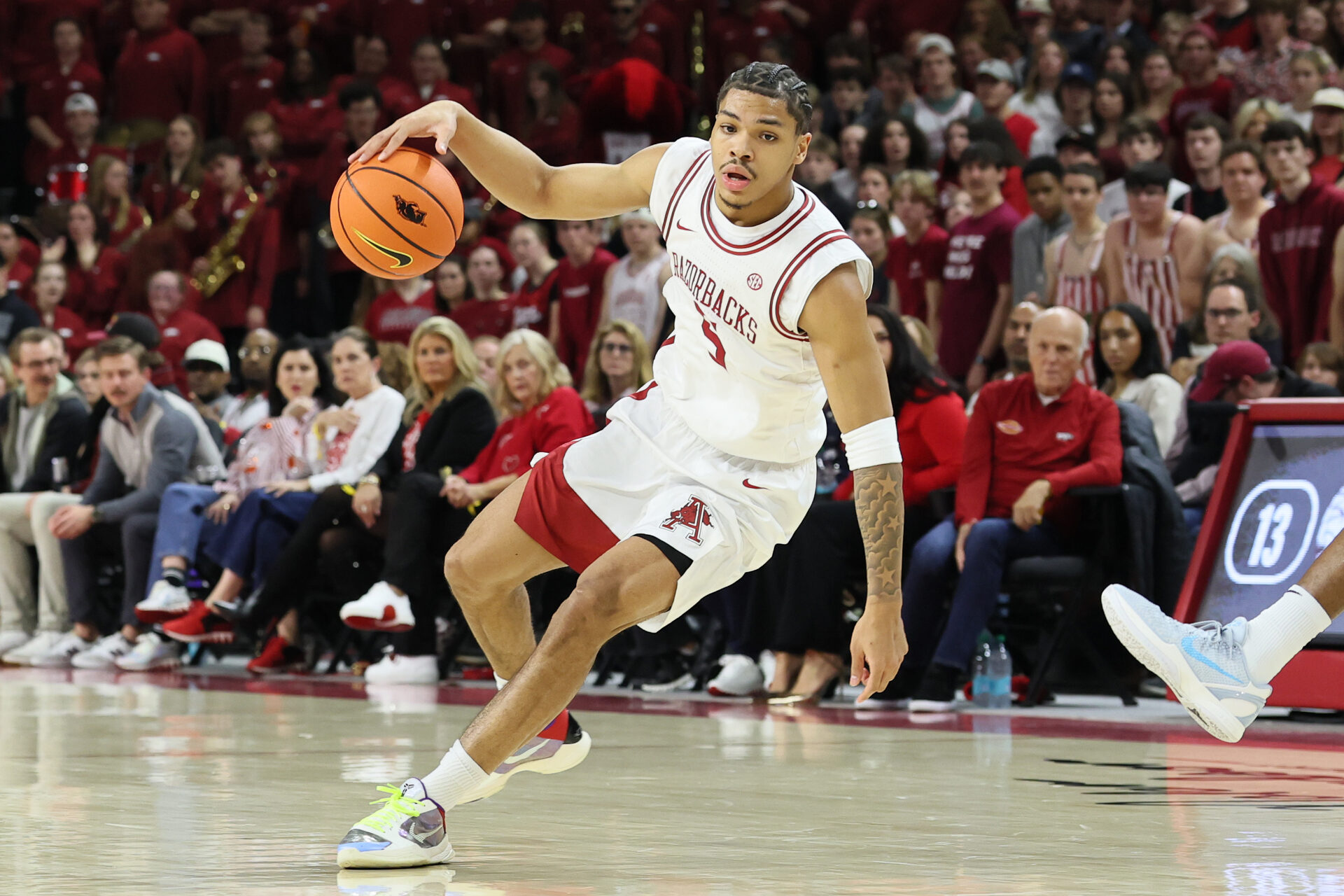 Arkansas Razorbacks guard Darius Acuff Jr (5) dribbles during the first half against the Auburn Tigers at Bud Walton Arena.