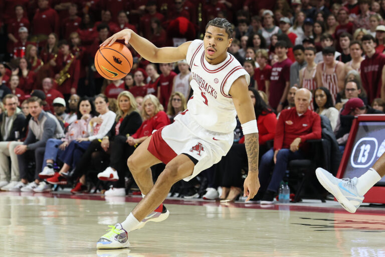 Arkansas Razorbacks guard Darius Acuff Jr (5) dribbles during the first half against the Auburn Tigers at Bud Walton Arena.