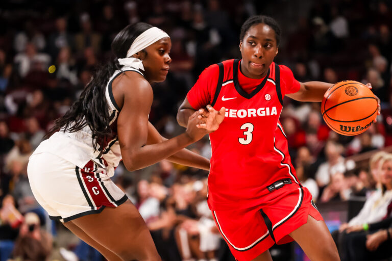 Georgia Bulldogs guard Dani Carnegie (3) drives around South Carolina Gamecocks guard Raven Johnson (25) in the second half at Colonial Life Arena.