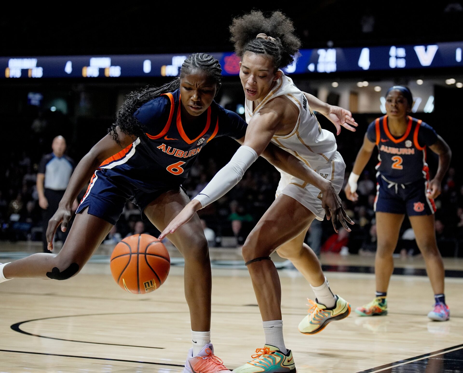 Vanderbilt guard Ndjakalenga Mwenentanda (15) reaches in knocking the ball away from Auburn forward Khady Leye (6) during the first half of an NCAA college basketball game at Memorial Gymnasium Thursday, Jan. 22, 2026, in Nashville, Tenn.
