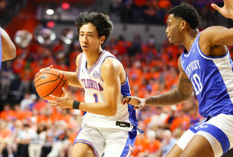 Florida guard Xaivian Lee (1) drives against Kentucky forward Brandon Garrison (10) during the second half of a NCAA mens basketball game at Steven C. O'Connell Center Exactek arena in Gainesville, FL on Saturday, February 14, 2026. [Alan Youngblood/Gainesville Sun]