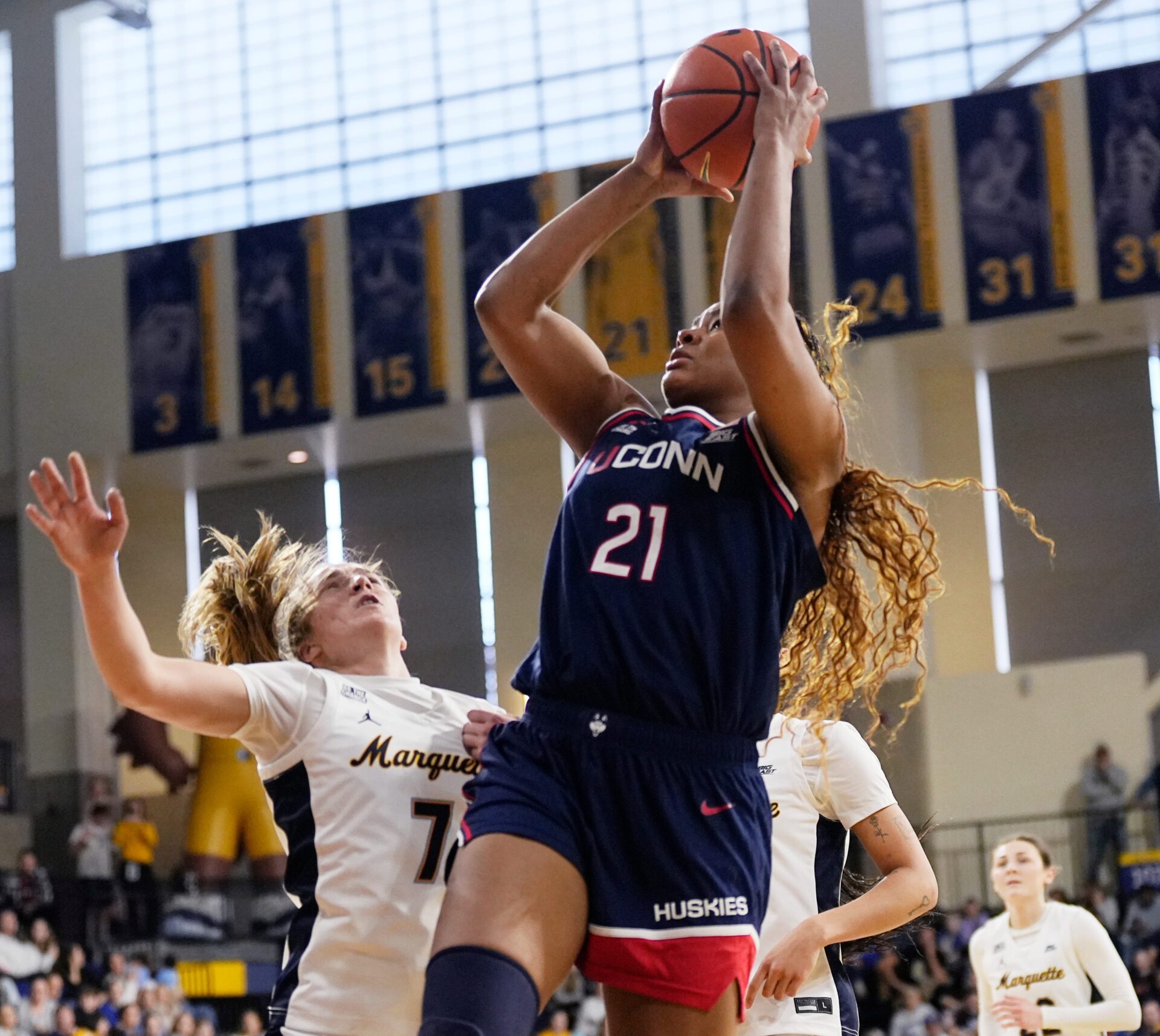 UConn Huskies forward Sarah Strong (21) scores during the fourth quarter of the game against the Marquette Golden Eagles on Saturday February 14, 2026 at the Al McGuire Center in Milwaukee, Wisconsin.