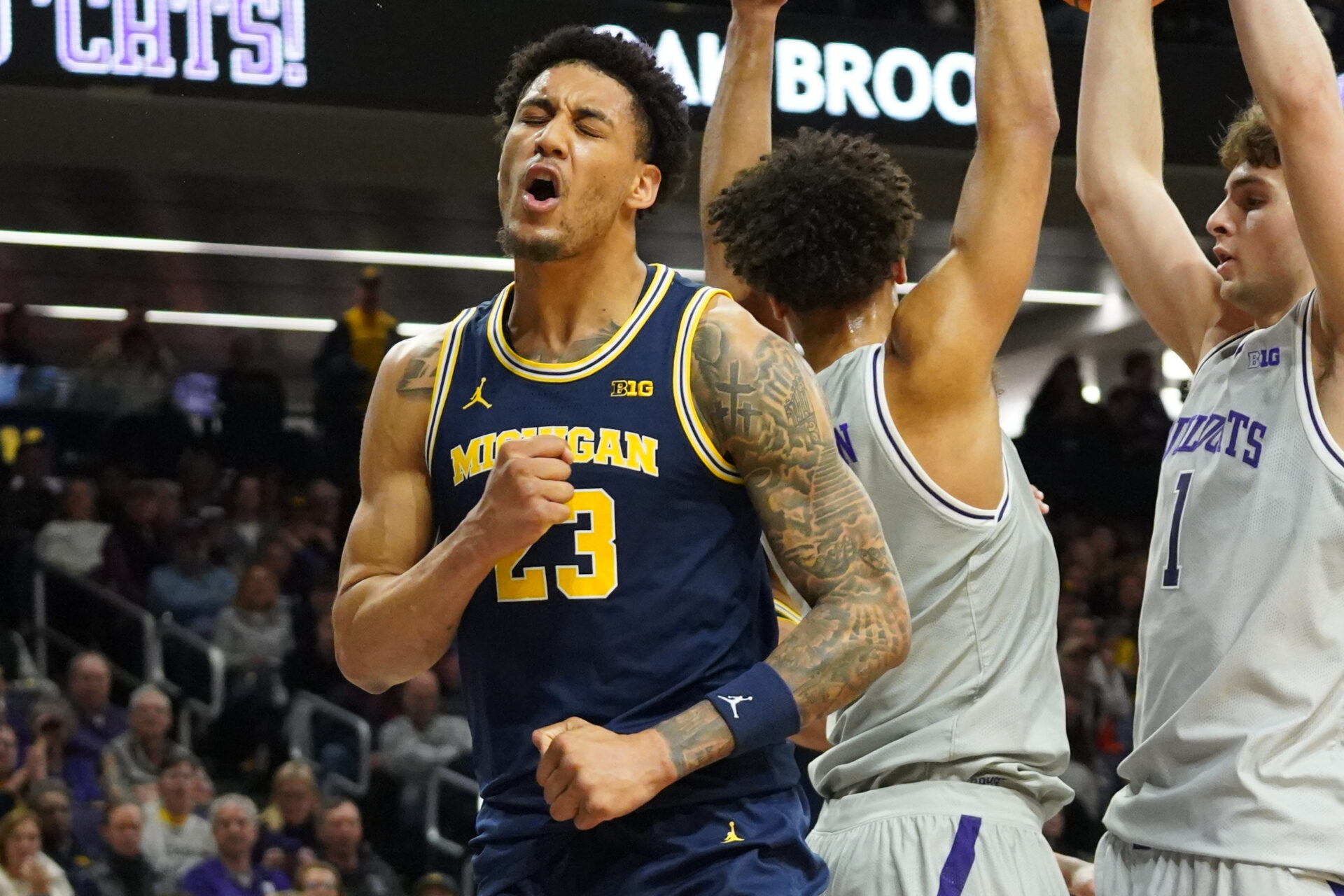 Michigan Wolverines forward Yaxel Lendeborg (23) reacts after scoring against the Northwestern Wildcats during the first half at Welsh-Ryan Arena.