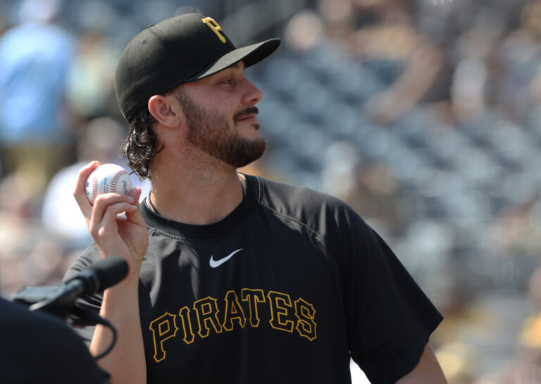 Pittsburgh Pirates pitcher Paul Skenes (30) tosses a ball to fans before the game against the Athletics at PNC Park.