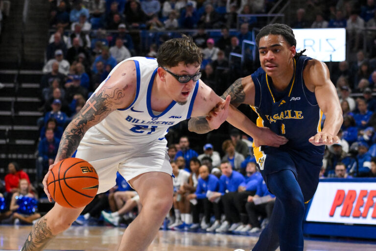 Saint Louis Billikens center Robbie Avila (21) drives to the basket as La Salle Explorers forward Nas Hart (8) defends during the first half at Chaifetz Arena.