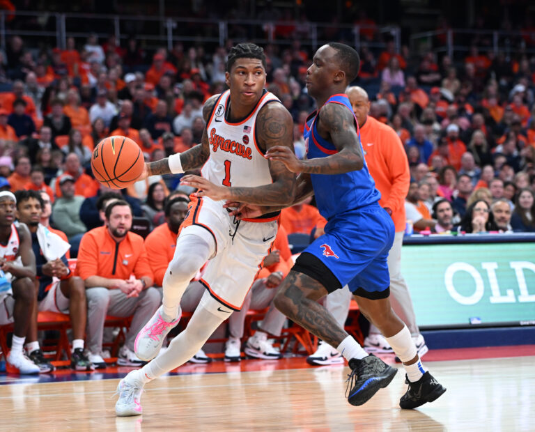 Syracuse Orange forward Donnie Freeman (1) oves the ball past Southern Methodist University Mustangs guard Boopie Miller (2) in the second half at the JMA Wireless Dome.