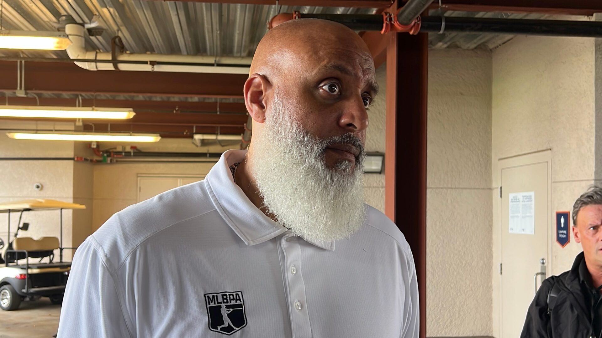 Major League Baseball Players Association executive director Tony Clark talks to reporters March 5, 2025, at Joker Marchant Stadium in Lakeland, Florida.