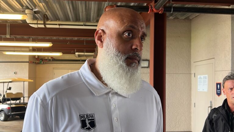 Major League Baseball Players Association executive director Tony Clark talks to reporters March 5, 2025, at Joker Marchant Stadium in Lakeland, Florida.