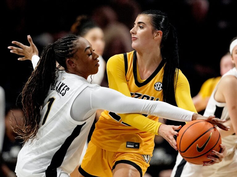 Missouri guard Chloe Sotell (22) is defended by Vanderbilt guard Mikayla Blakes (1) during the first half of an NCAA college basketball game at Memorial Gymnasium Thursday, Jan. 8, 2026, in Nashville, Tenn.